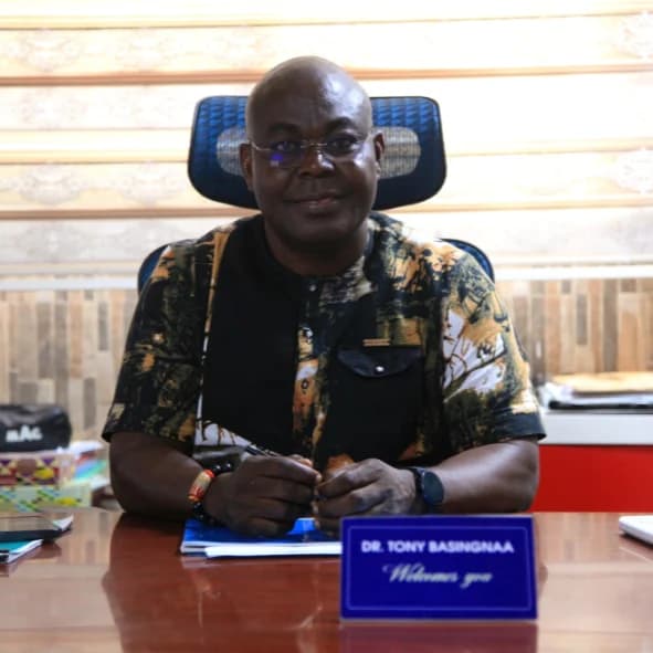 Dr Tony Basingnaa seated at his desk